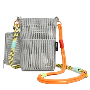 Close-up of grey mesh crossbody bag with vibrant orange and yellow braided rope strap