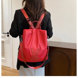 Red fashion backpack featuring cute glitter rabbit patch and versatile straps