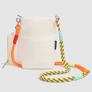 Detail of white mesh crossbody bag with orange climbing rope strap and small coin pouch