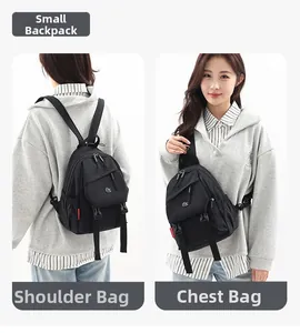 Detail view of black oxford fabric backpack showing dual-use as a chest and shoulder bag