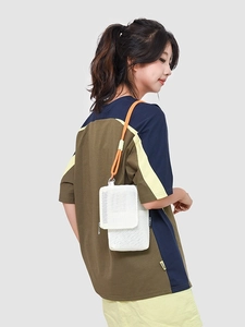 White mesh crossbody bag with dual zipper pockets and vibrant orange rope strap for travel