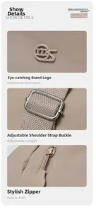 Detail of adjustable woven shoulder strap with silver buckle and logo zipper pulls