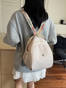 Zaino multifunzionale beige da donna con spallacci floreali e grande capacità interna