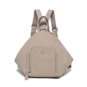 Detail view of the triangular light khaki backpack with MS logo and zip front pocket