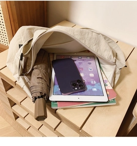 Interior view showing the large capacity and storage space of the beige oxford tote bag