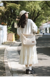 Waterproof nylon crossbody bag in cream white styled with a casual Japanese outfit