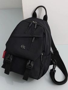 Minimalist black oxford fabric laptop backpack with dual buckle flap and metal logo