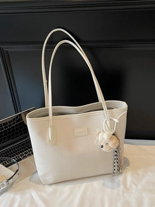 Chic cream herringbone tote bag with leather straps and cute bear pendant for work