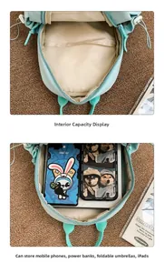 Detail view of large capacity mint green crossbody bag showing spacious inner compartment