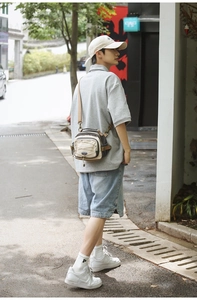 Detail of khaki mixed-color nylon crossbody bag with adjustable shoulder strap