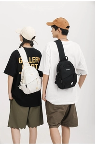 Dual perspective of black and white nylon crossbody bags on models with adjustable straps