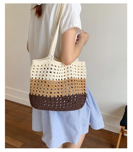 Detail of three-color striped crochet tote bag with hollow knit texture and shoulder strap