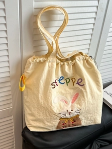 Cute cream embroidery canvas tote bag with rabbit design and drawstring closure