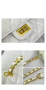 Detail shot of white quilted leather texture with gold-tone metal chain and twist-lock
