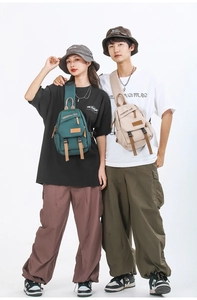 Outdoor crossbody chest bags in forest green and sand color with adjustable shoulder straps