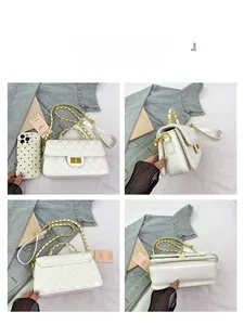 Detailed views of a white quilted crossbody bag with gold chain strap and metal lock