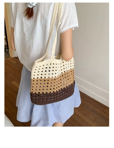Detail of tricolor crochet tote bag featuring wide-mesh knitting and shoulder strap
