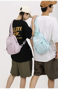 Detailed view of lavender and light blue nylon crossbody bags worn by models