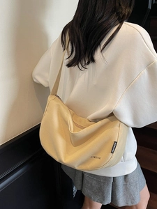 Minimalistische hellgelbe Canvas-Umhängetasche in Halbmondform mit Reißverschluss für Damen