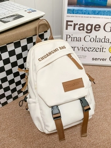 Minimalist off-white sports chest bag with brown straps in a cozy lifestyle setting