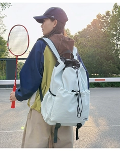 Close-up of light blue water-resistant drawstring backpack for outdoor activities