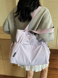 Lavender purple canvas tote bag with side drawstring detail for daily commute