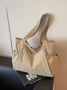 Large khaki casual canvas tote bag with adjustable side drawstring for daily commute