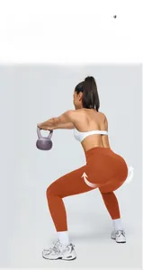 Detail of high-waist yoga pants in caramel showing elastic fabric and squat-proof fit