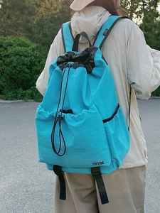 Water-resistant lake blue drawstring sports backpack for outdoor hiking and casual use