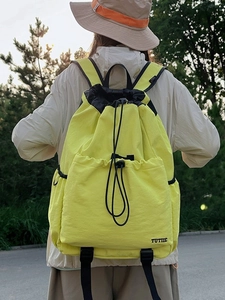 Waterproof yellow nylon drawstring sports backpack with front pocket and TUTIIE logo