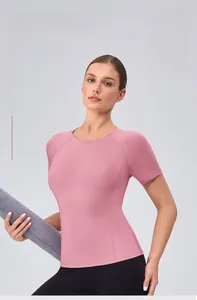Detail of pink slim fit yoga t-shirt with raglan sleeves and moisture-wicking fabric
