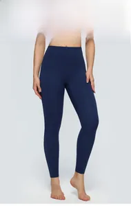 Detail of high-waist yoga leggings in dark blue, showing soft brushed fabric and slim fit