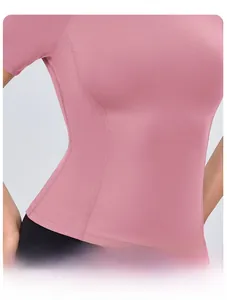 Close-up of pink yoga top featuring four-needle six-wire flatlock stitching for comfort
