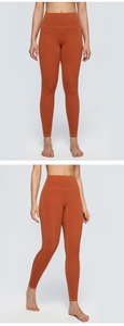 Detail view of high-waisted seamless yoga pants in orange-red showing firm compression fit