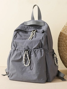 Minimalist dark gray waterproof travel backpack with large capacity and drawstring pocket