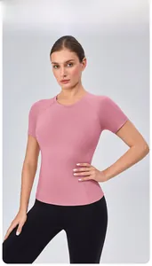 Detail of the high-stretch stitching and raglan sleeve design on pink yoga t-shirt