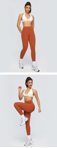 Detail showing high-waisted burnt orange yoga pants with sculpting peach-lift effect