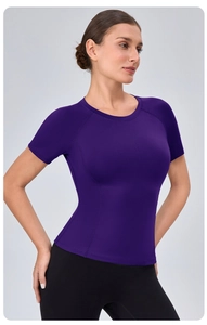 Detail view of reinforced stitching and breathable fabric on purple yoga t-shirt