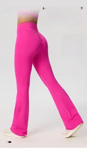 Detail of high-waisted rose red yoga pants showing butt-lifting effect and soft texture