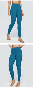 Detail view of high-waist yoga leggings showing reinforced stitching in peacock blue
