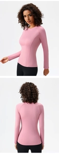 Front and back views of pink slim fit yoga top with raglan sleeves and flat seams