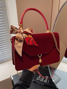 Elegant red velvet bridal handbag with golden chain strap and printed silk scarf