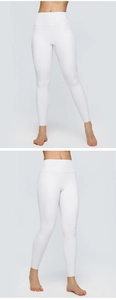 Detailed view of high-waist white yoga leggings with elastic compression fabric