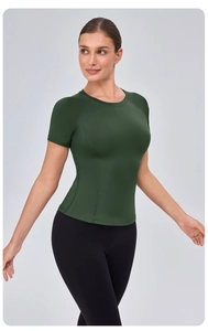 Detailed view of dark green slim fit yoga shirt with ergonomic seams and raglan sleeves