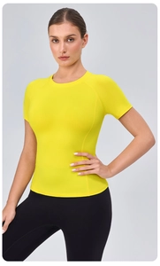 Detail of bright yellow breathable slim fit yoga t-shirt with crew neck design