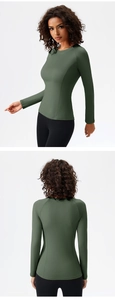 Detail view of olive green slim fit yoga top with raglan sleeves and side seam stitching