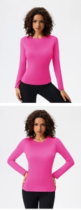 Close-up of pink long-sleeve yoga shirt featuring ergonomic seams and quick-dry fabric