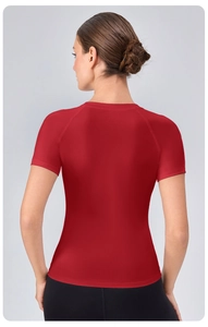 Detail view of the back of a red slim-fit women's sports t-shirt with raglan sleeves