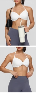 Detail view of white halter yoga bra and purple high waisted leggings workout set