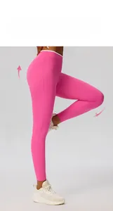 Detail of high-waisted yoga leggings in bright pink with seamless high-stretch fabric